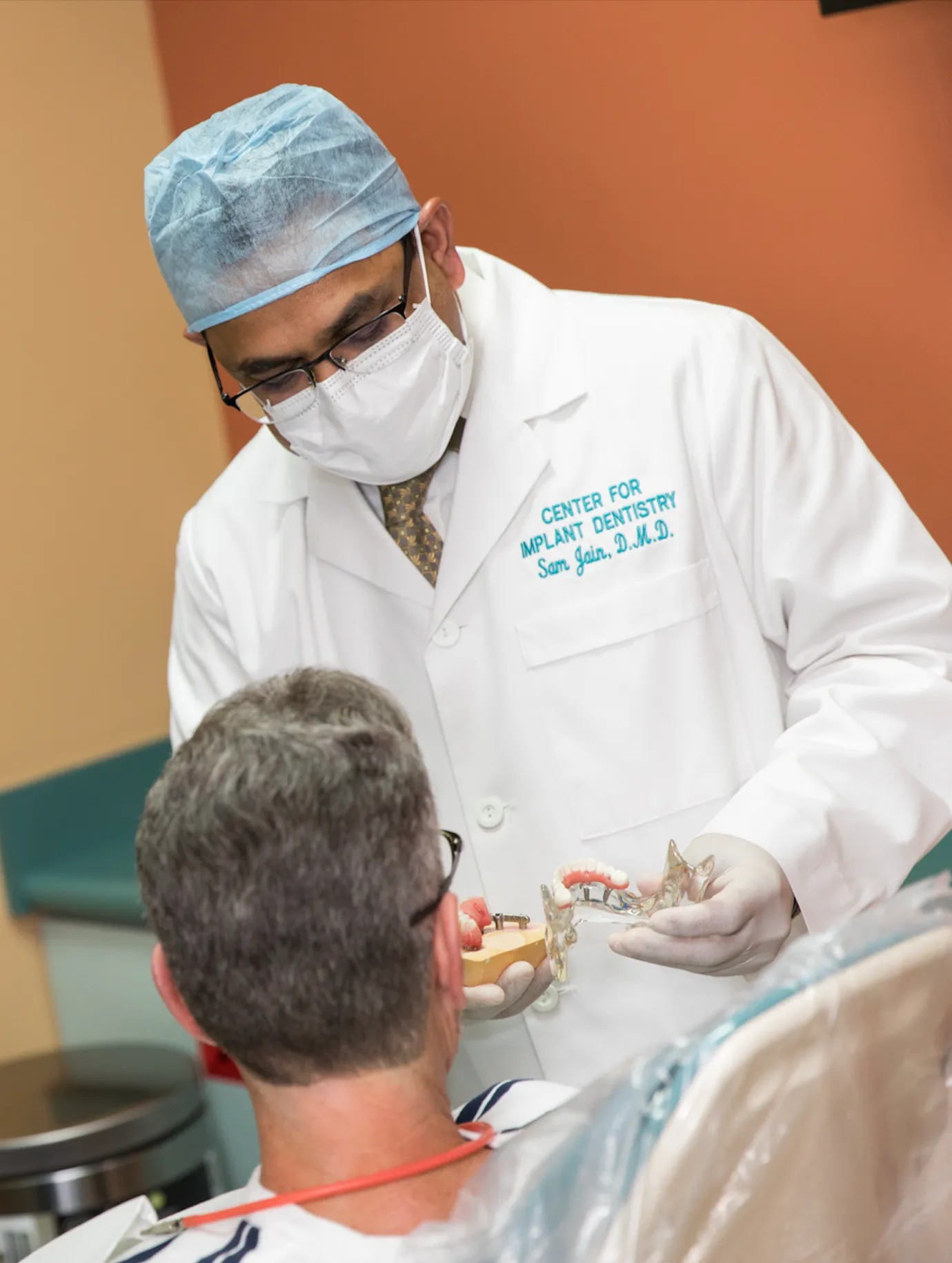 Dr. Sam Jain performing a dental implant procedure