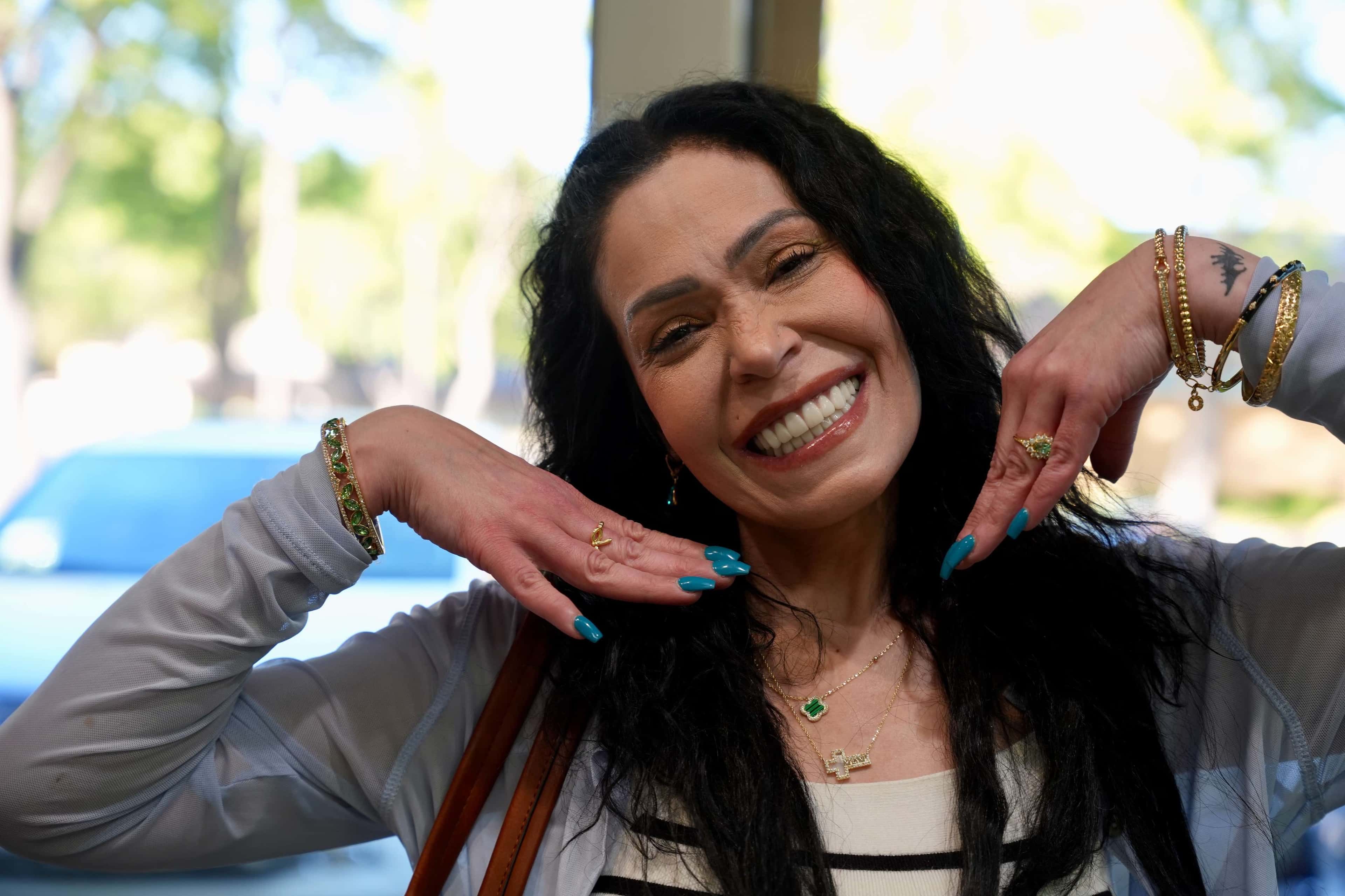 Patient displaying their natural-looking smile after expert dental implant reconstruction